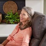 Woman relaxing in Golden Titan Medium 2 recliner chair